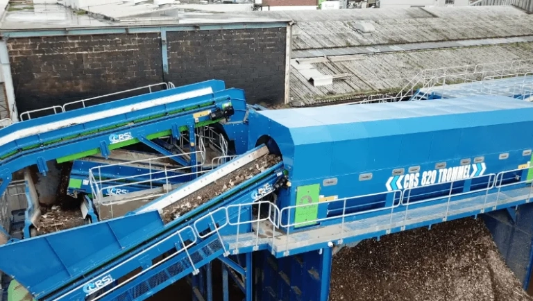 Heavy-duty trommel screen separating mixed recyclables at a waste processing facility